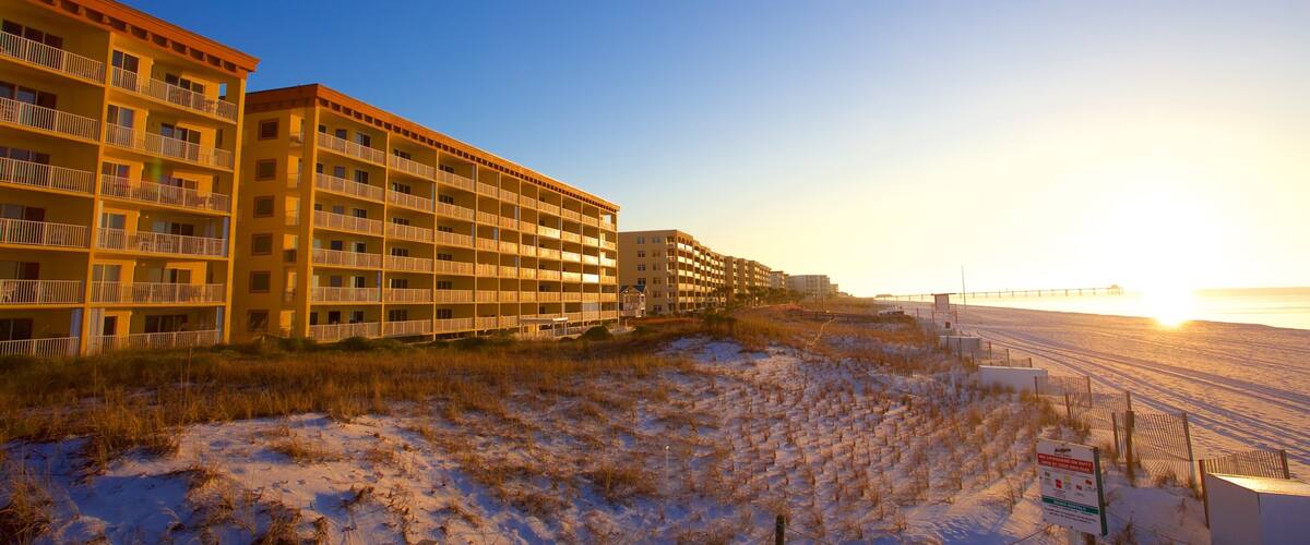 Fort Walton Beach which includes a sunset, a sandy beach and a hotel