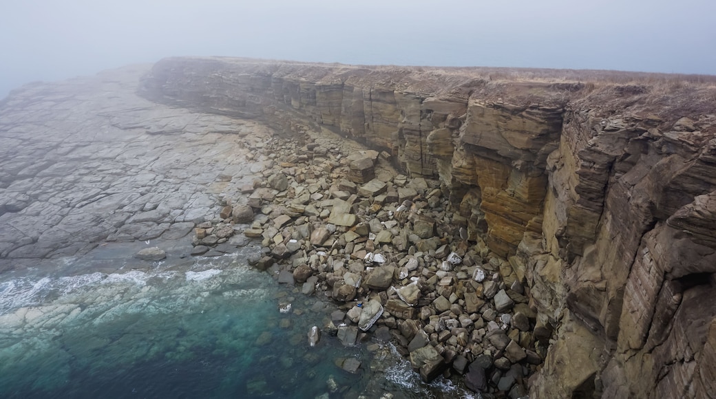 The rocky and foggy coastline of Russky Island