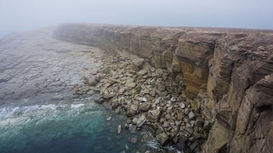 The rocky and foggy coastline of Russky Island