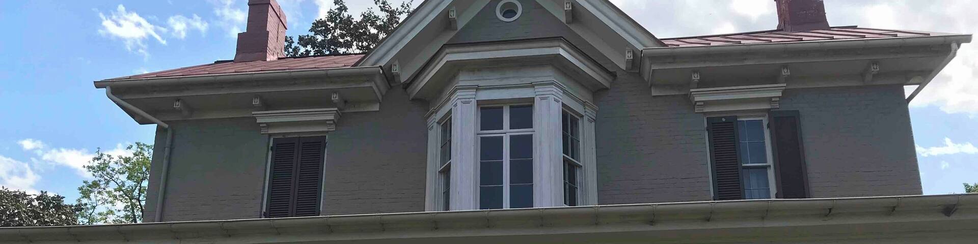 The Frederick Douglass National Historic Site, administered by the National Park Service, is located at 1411 W Street, SE, in Anacostia, a neighborhood east of the Anacostia River in Southeast Washington, D.C.. Established in 1988 as a National Historic Site, the site preserves the home and estate of Frederick Douglass, one of the most prominent African Americans of the 19th century. Douglass lived in this house, which he named Cedar Hill, from 1877 until his death in 1895. Perched high on a hilltop, the site also offers a sweeping view of the U.S. Capitol and the Washington, D.C., skyline.