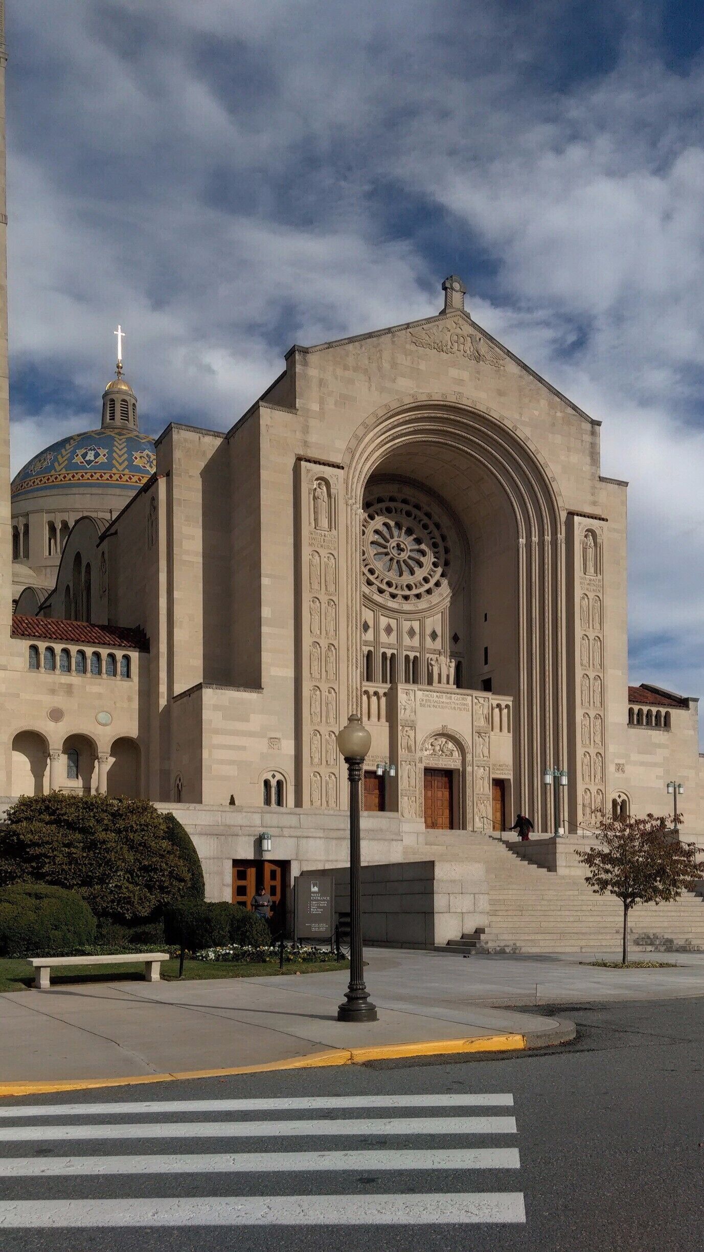 The shrine is the largest Catholic church in the United States and North America, one of the ten largest churches in the world, and the tallest habitable building in Washington, D.C. Construction of this church, notable for its Neo-Byzantine architecture, began in 1920 under Philadelphia contractor John McShain. It opened unfinished in 1959 and currently hosts an estimated one million pilgrims each year.