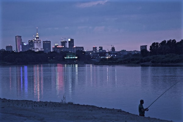 There is a running/biking path that runs the length of the Vistula in Warsaw. I cannot remember the exact location of this particular spot along the river, but I caught a great view of the city center and a fisherman casting his line. Warsaw is beautiful.
