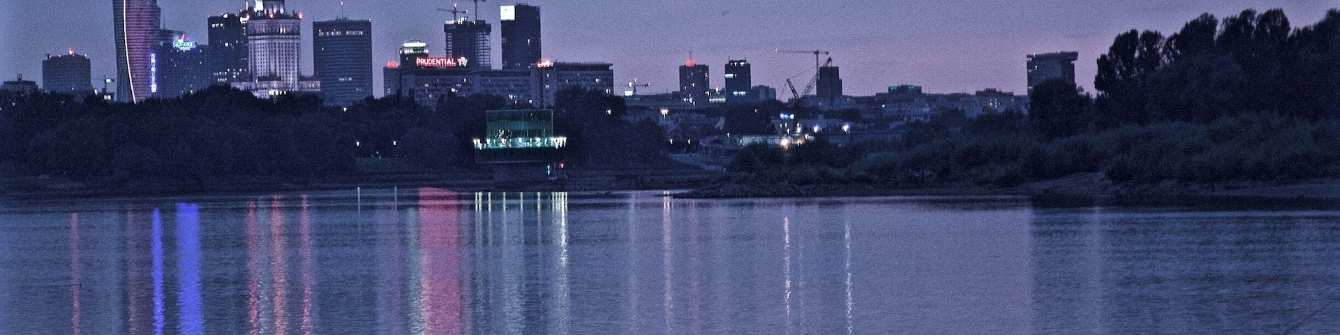 There is a running/biking path that runs the length of the Vistula in Warsaw. I cannot remember the exact location of this particular spot along the river, but I caught a great view of the city center and a fisherman casting his line. Warsaw is beautiful.