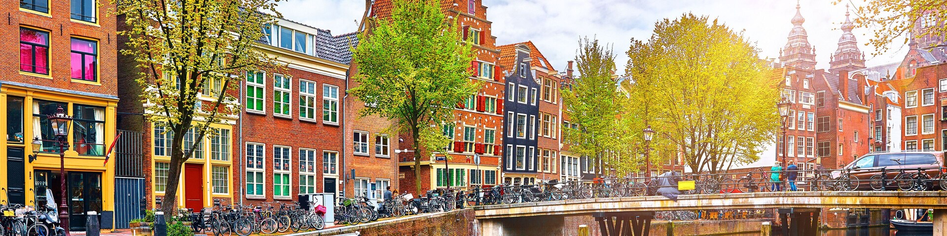 Channel in Amsterdam Netherlands houses river Amstel landmark