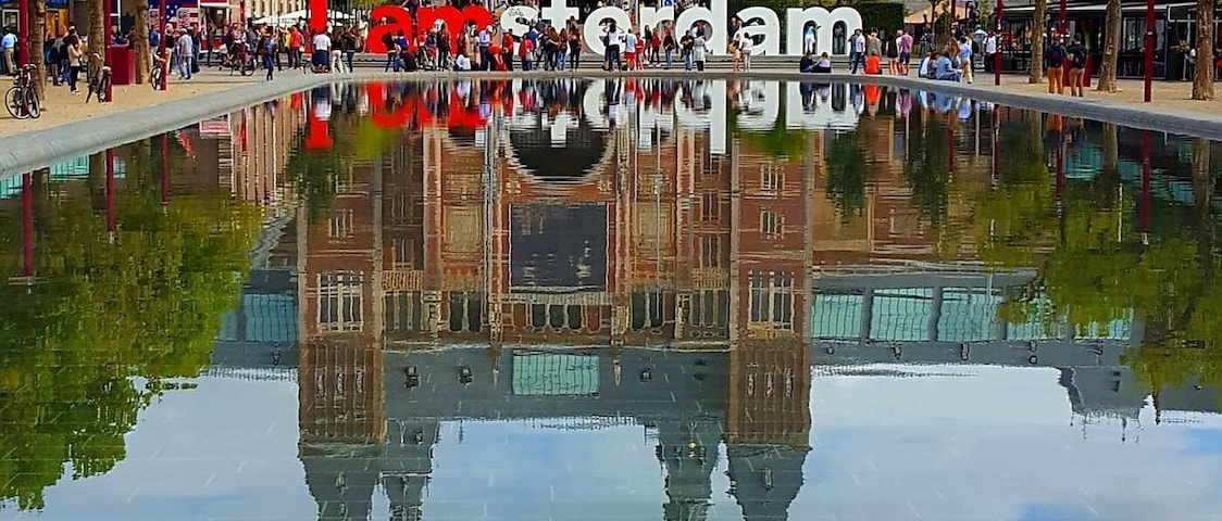 Rijksmuseum with the iconic "I amsterdam" letters. The museum houses many pieces of the famous Dutch masters.