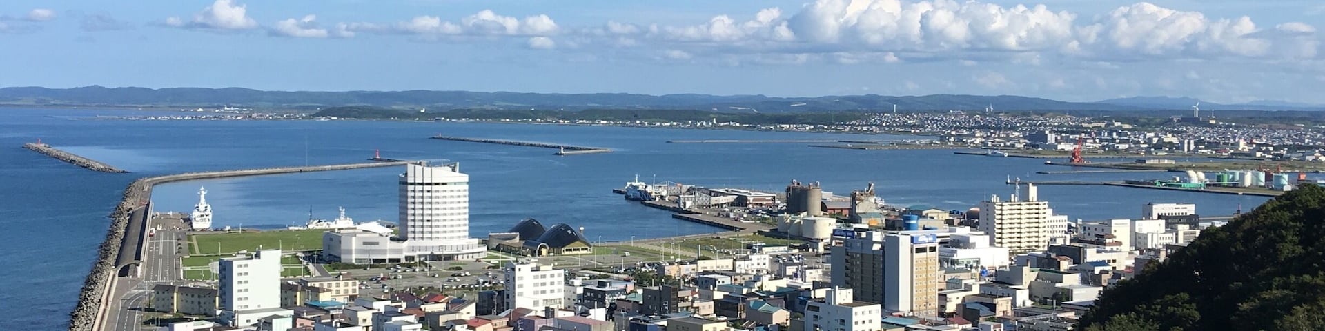 City of Wakkanai can be seen from Wakkanai Park which is up the hill or from Centennial Tower which offers a clear view of entire city and also the island of Rishiri.
While Wakkanai was just a getaway to the island of Rishiri and Rebun I had a very pleasant stay here. It is quiet and clean with the freshest air! While there isn't much other than a fishing industry here it is here I realized that Japanese had it good as a citizen more than any other parts of the world. 
We know there are inequalities as a citizen in most part of the world in that the richer cities or sectors of a country will have it better than others in term of basic infrastructure and communal facilities. Not so much in Japan though, even the most remote places its citizen enjoys the same basic services as other parts of the country. That's quite a feat as far as I am concerned. One won't feel one is lacking even if one is few thousand miles away from the core of civilization (as in Tokyo, Osaka and Kyoto). I think that sums up why Japanese are contented and law abiding no matter where they live! They even queue for basic necessities after a tsunami where they have lost everything they possess! No other country has such discipline and order in its citizens!