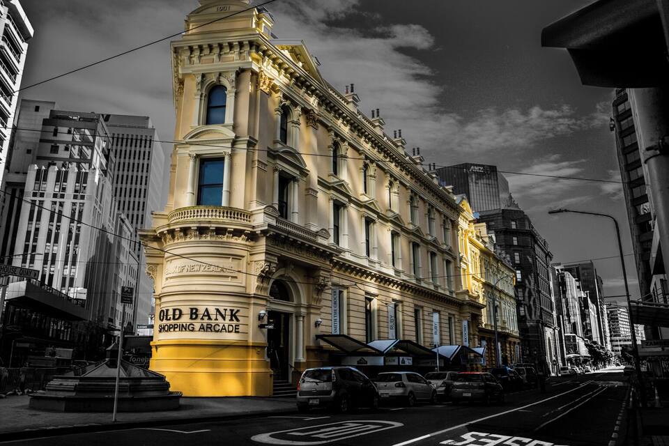 A historic building with ornate architecture, labeled as the Old Bank Shopping Arcade.