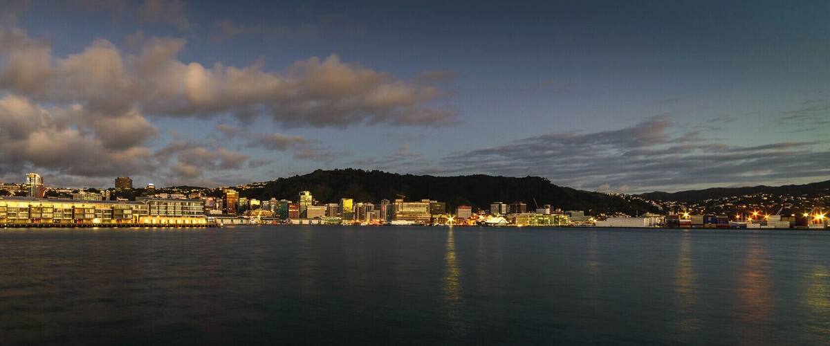 A predawn view of the recently rebuilt Chaffers Wharf, with the CBD of Wellington behind, as seen from a small breakwater near Freyberg Pool