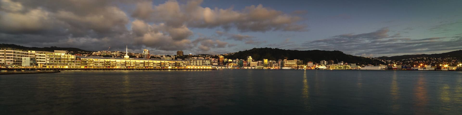 A predawn view of the recently rebuilt Chaffers Wharf, with the CBD of Wellington behind, as seen from a small breakwater near Freyberg Pool