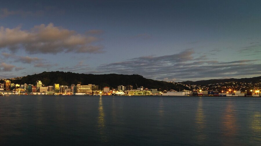 A predawn view of the recently rebuilt Chaffers Wharf, with the CBD of Wellington behind, as seen from a small breakwater near Freyberg Pool