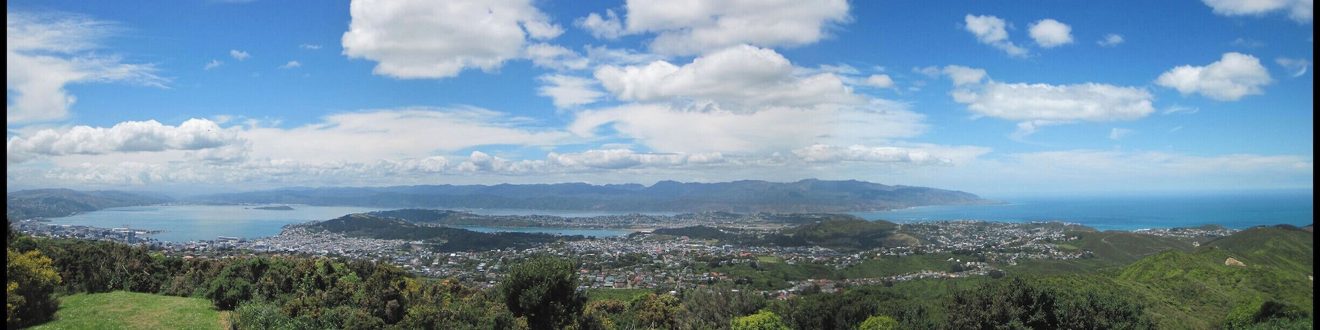 View of Wellington harbour (left) to Island Bay (right) from atop the hill at the Wellington Wind Turbine.