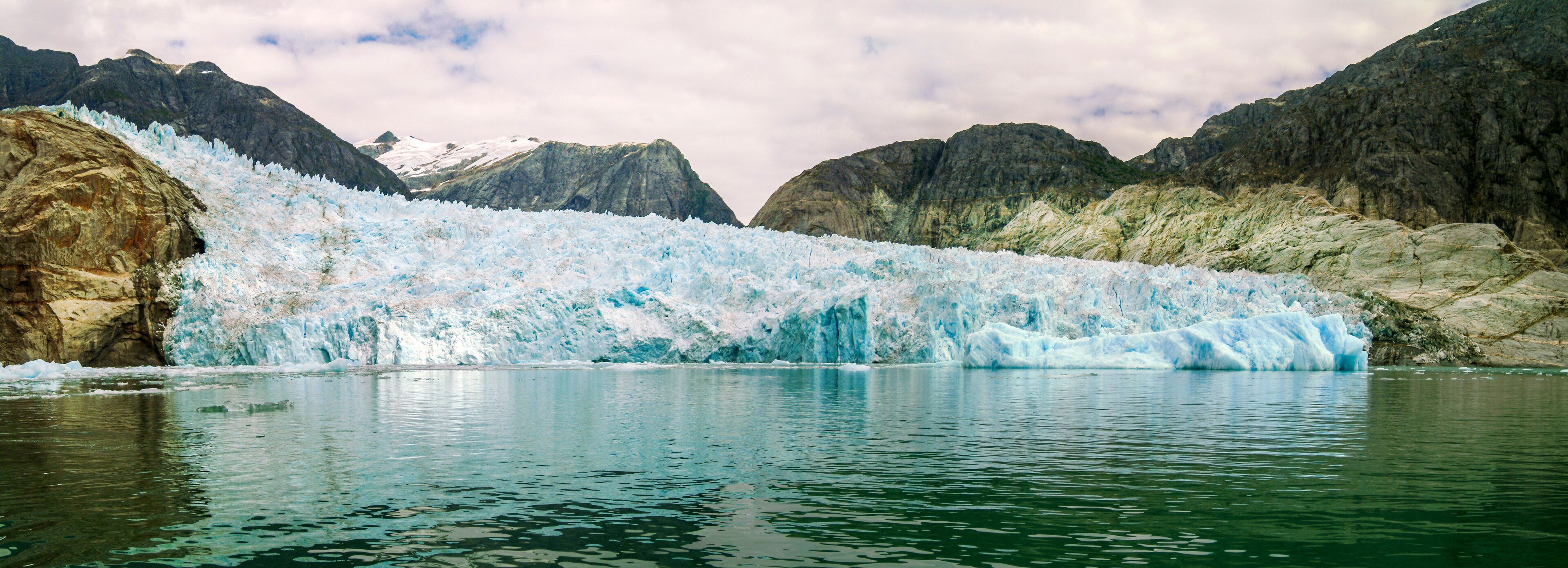 The LeConte Glacier in Southeast Alaska. The glacier is a popular tourist destination, with operators from nearby Petersburg and Wrangell, Alaska, running excursions to its calving face.