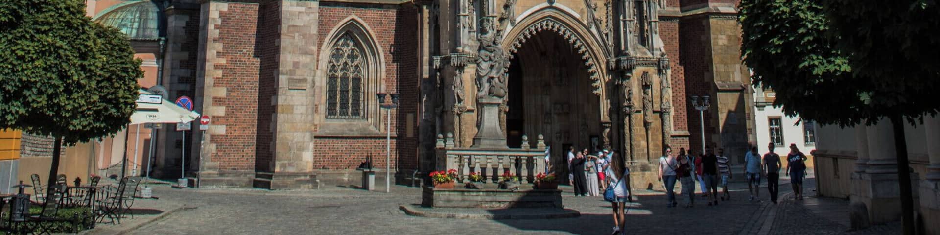 A large, historic church with two tall spires and intricate architectural details.