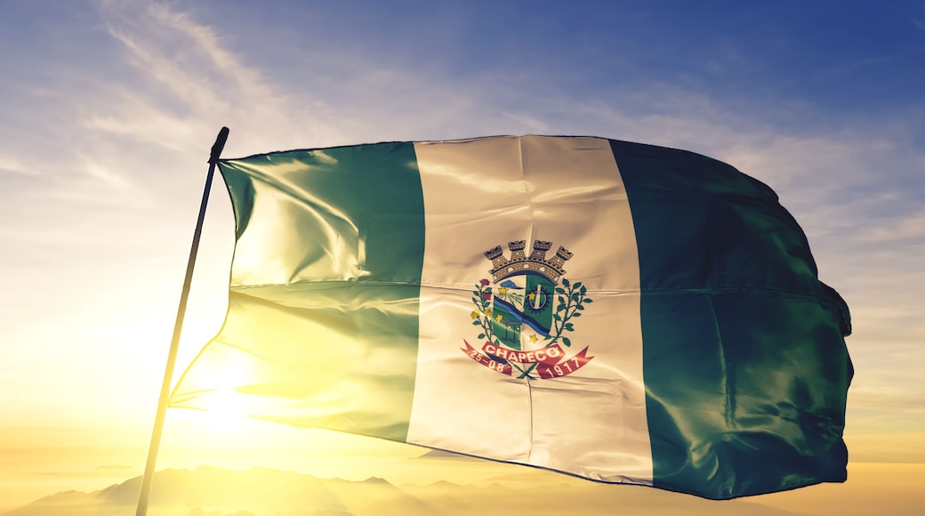Chapeco of Brazil flag waving on the top sunrise mist fog