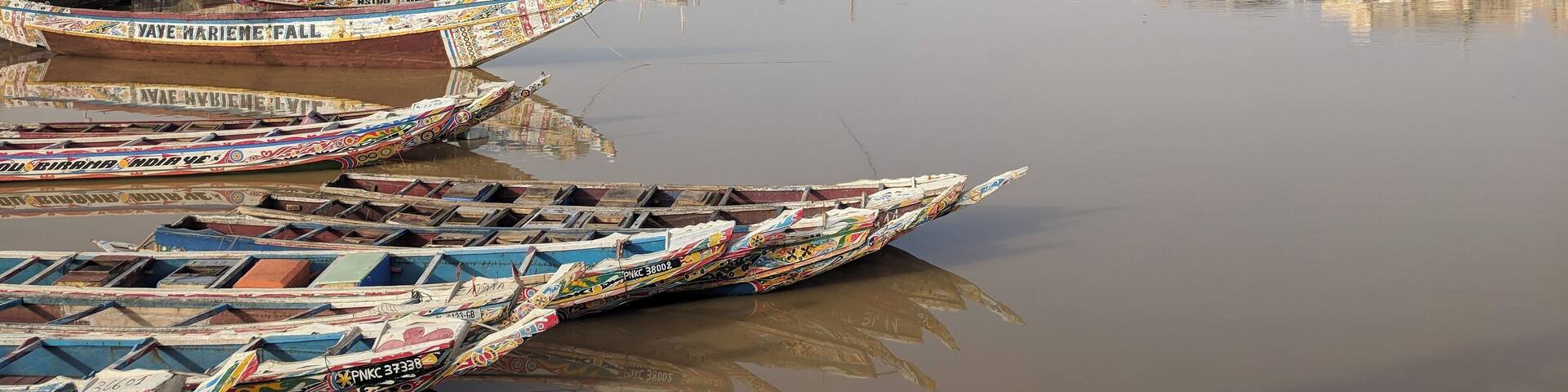 Les pirogues! Colorfully painted, these serve the fishermen well as they capture their fish, for sale at the market or for their own table at home. #culture October 2018