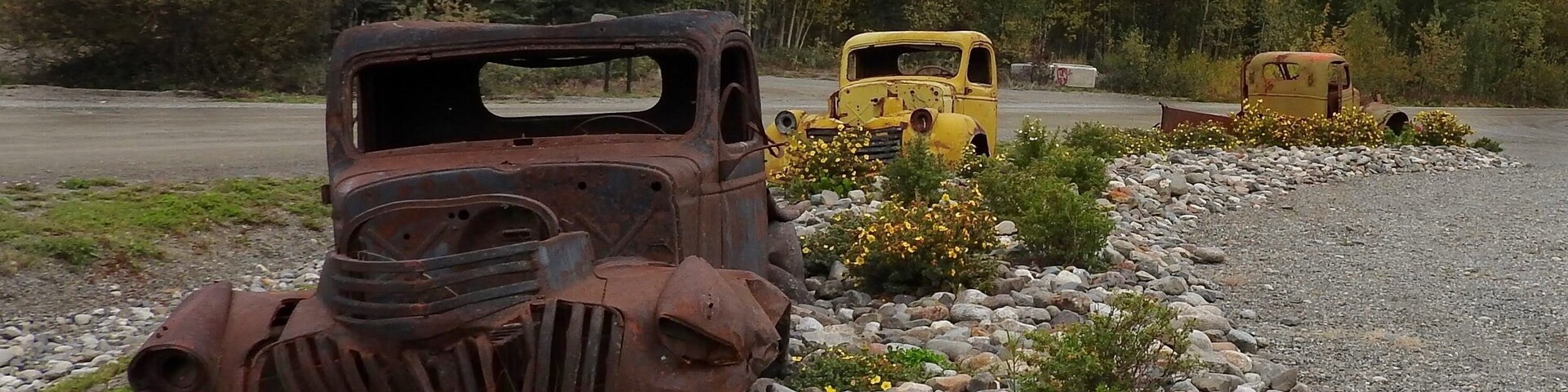 J 0 Junction of the South Canol Road with the Alaska Highway; rest area toilets, a few WWII vehicles from the Canol Project on display, and interpretive signs on the history and construction of the Canol Road. (September 2016)