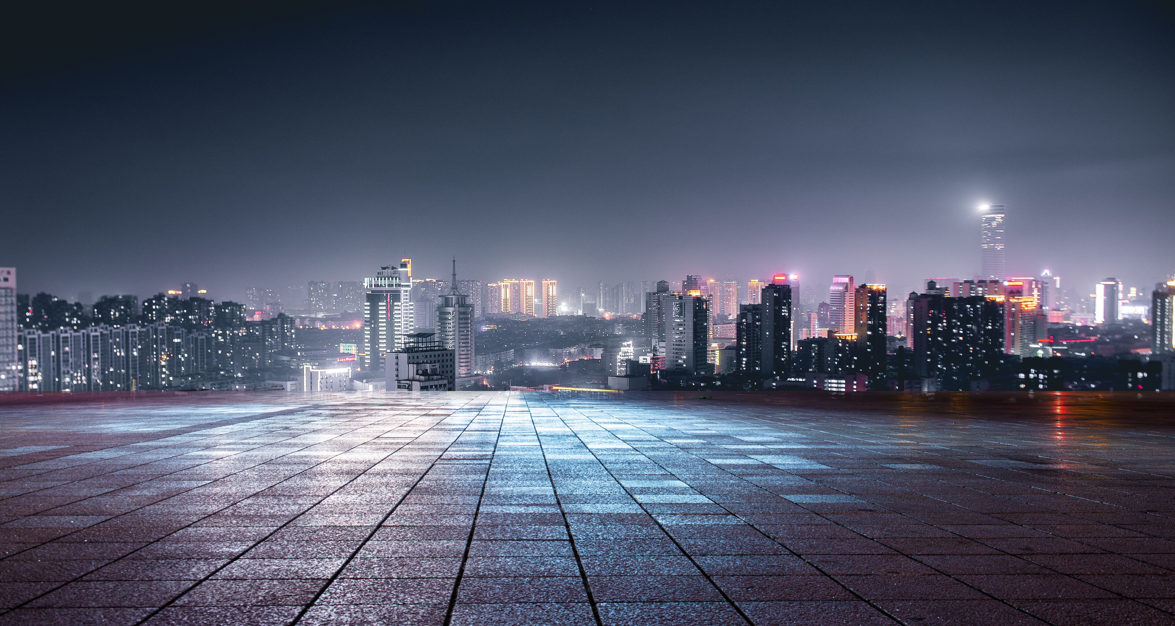 Night view of city lights in front of marble square, Xuzhou, China