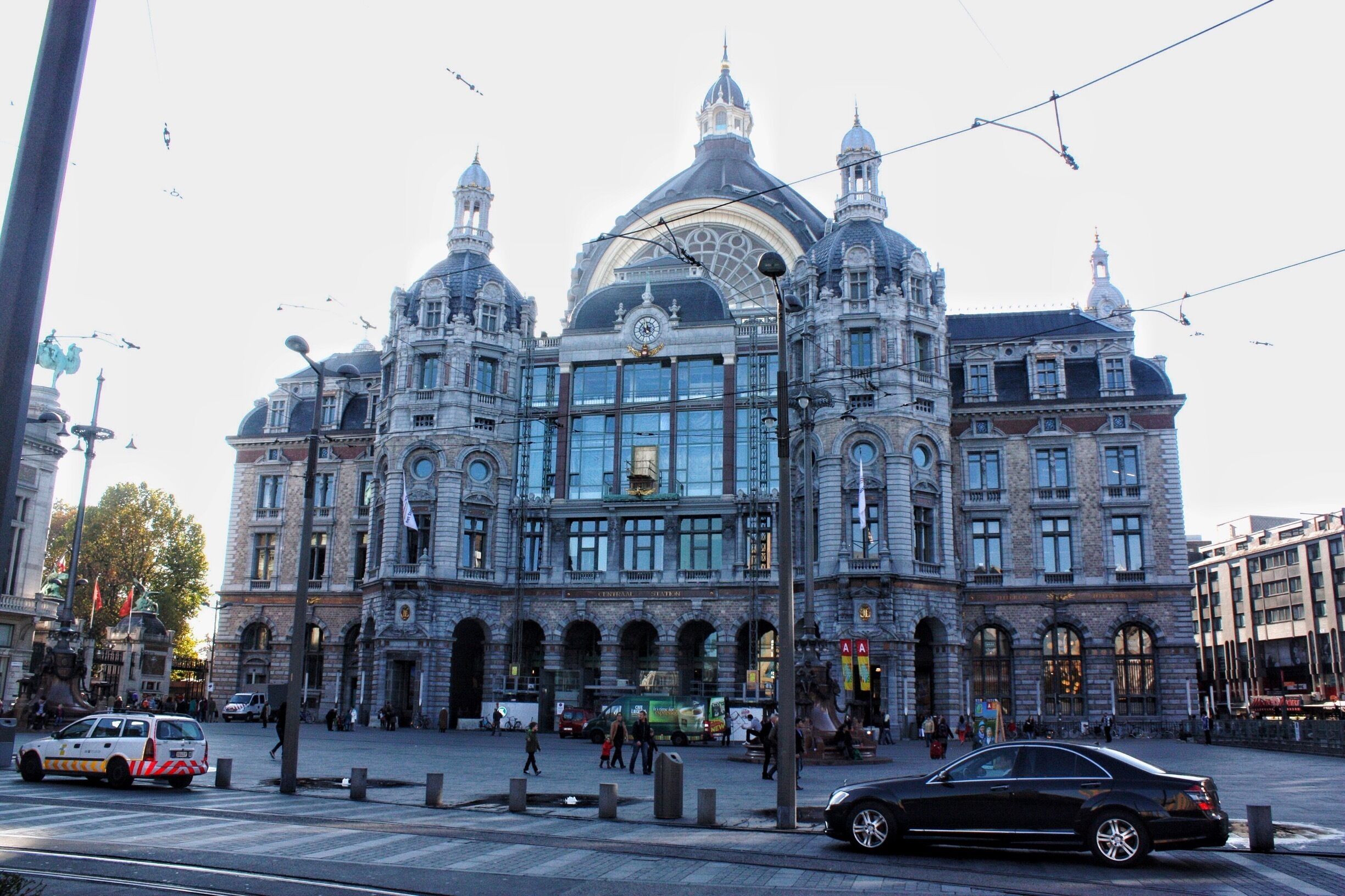 A historic building with ornate architecture, large windows, and a prominent dome.