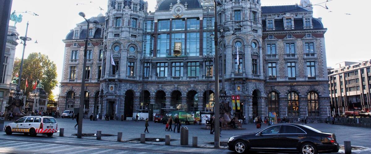 A historic building with ornate architecture, large windows, and a prominent dome.