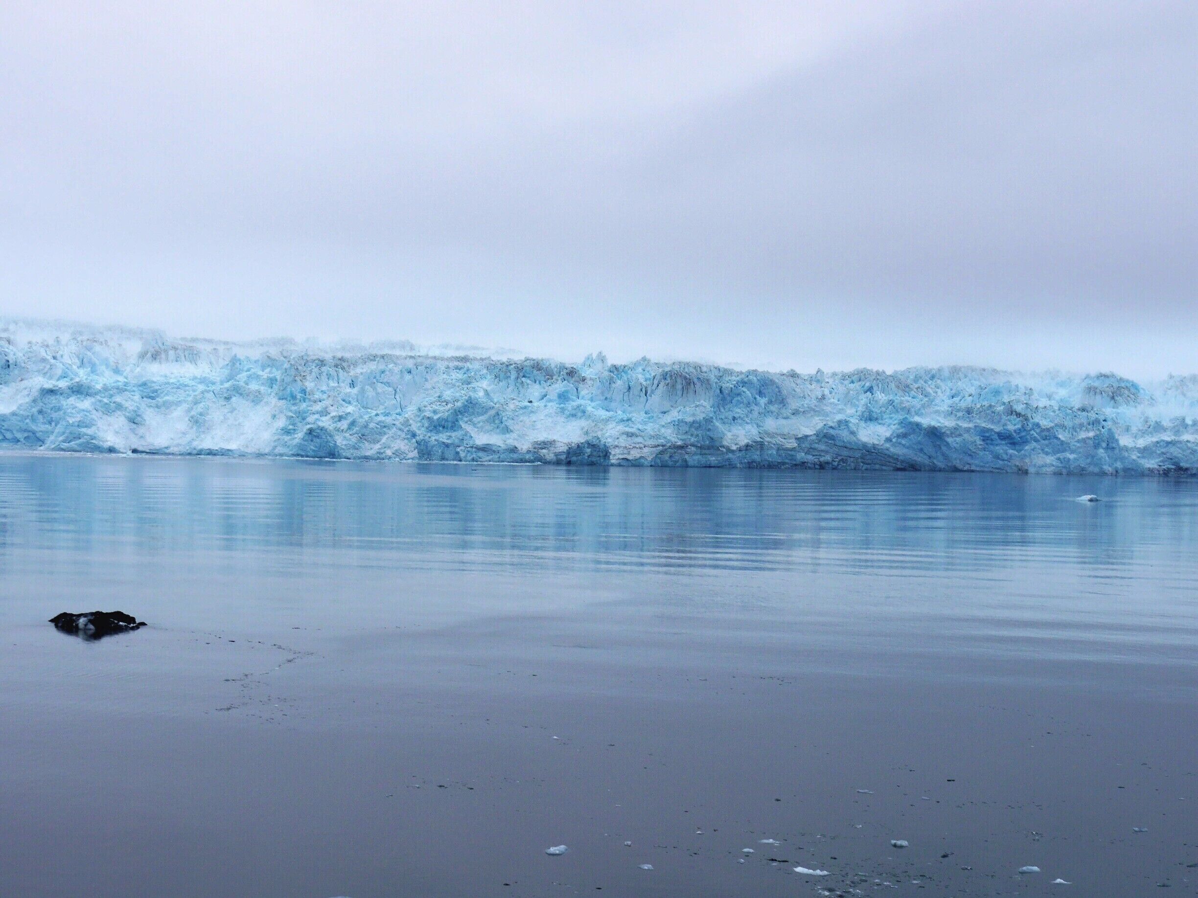 Tall, wide and generally massive, Hubbard Glacier is a natural wonder in glacial blue. The largest tidewater glacier in North America at a whopping 76 miles long, 1,200 feet deep and over 6 miles wide at it’s outflow. The part of the face you see here is around 200 feet high though in places it can be up to 400 feet. It is a major  calving glacier.  We saw some relatively minor activity but sadly missed the photo opportunity.  However it is a mesmerising and awesome sight somehow made the more so in the overcast atmospheric conditions when we were there. 