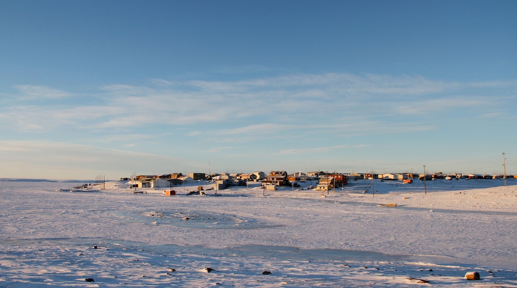 Arctic community of Cambridge Bay in the fall with snow on the ground and blue skies