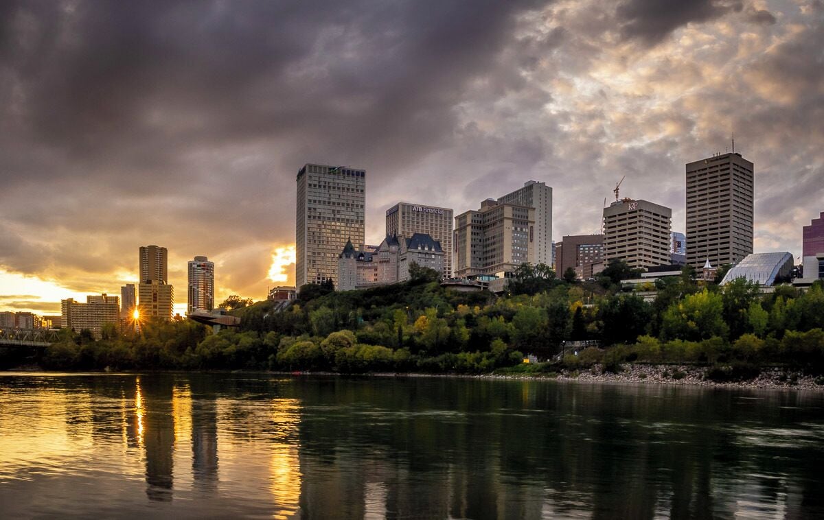This location is along the Saskatchewan River in the city of Edmonton. The actual spot is the Henrietta Muir Edwards Park. Its a great view of Edmonton's skyline along the river and is an ideal sunset photography location. The best spot is actually right where the river boat docs, but you can explore the rivers edge looking for other locations.  Edmonton is a great city. If you haven't been. Check it out. 