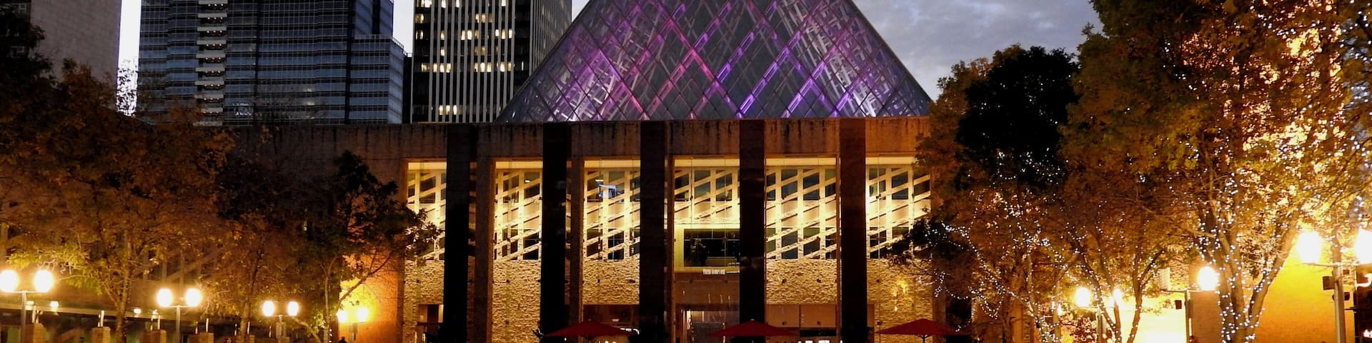 Edmonton's City Hall is the home of the municipal government of Edmonton, Alberta, Canada. Designed by Dub Architects, the building was completed in 1992. It was built to replace the former city hall after it had become outdated and expensive to operate. The building features two steel and glass pyramids, one 43 metres high (ground to peak), on top of a three-storey concrete structure. One pyramid provides natural light for the main atrium, the other for the council chambers. The building also features a 200-foot clock Friendship Tower topped with a set of 23-carillon bells. Located on the eastern edge of the financial district in Edmonton's downtown, the building is the main feature on Sir Winston Churchill Square. In the winter, the fountain is converted to a skating rink.
#Edmonton #pyramid #Trovember