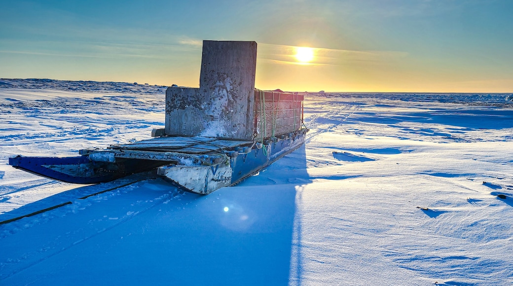 Qamutiik on the polar ice at sunset. These sleds are what are used in the arctic tundra of Canada