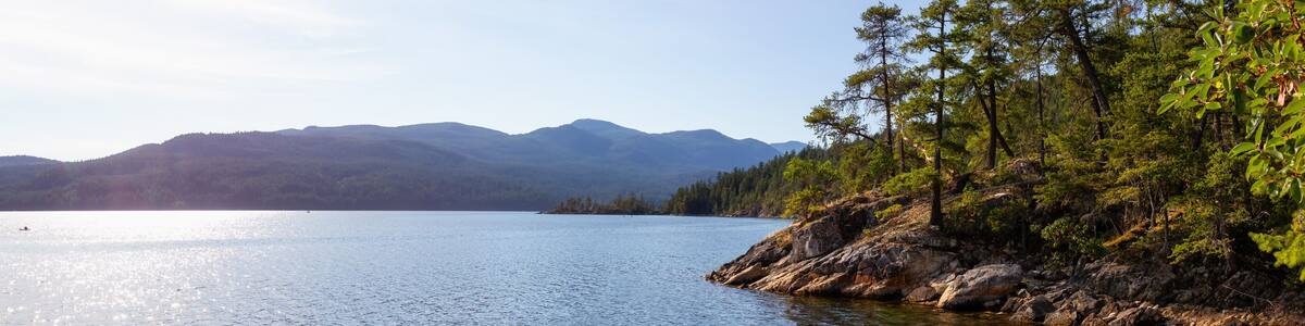 Beautiful landscape picture of Sechelt Inlet during a vibrant sunny summer day. Taken in Sunshine Coast, BC, Canada.