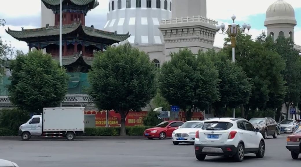 A Buddhist temple in front of a Mosque in Yining, China.