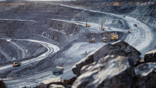 Work of heavy equipment in an open pit