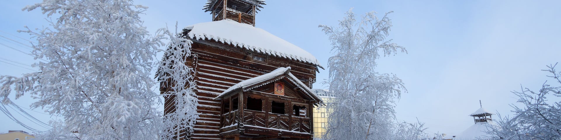 Yakutsky Ostrog, Yakutsk, Republic of Sakha (Yakutia), Russia. Wooden fortress tower, recreated on the territory of the historical and architectural complex "Old Town" in the center of Yakutsk. Winter