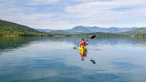 A teenage boy kayaking on White Lake, White Lake Provincial Park; British Columbia, Canada