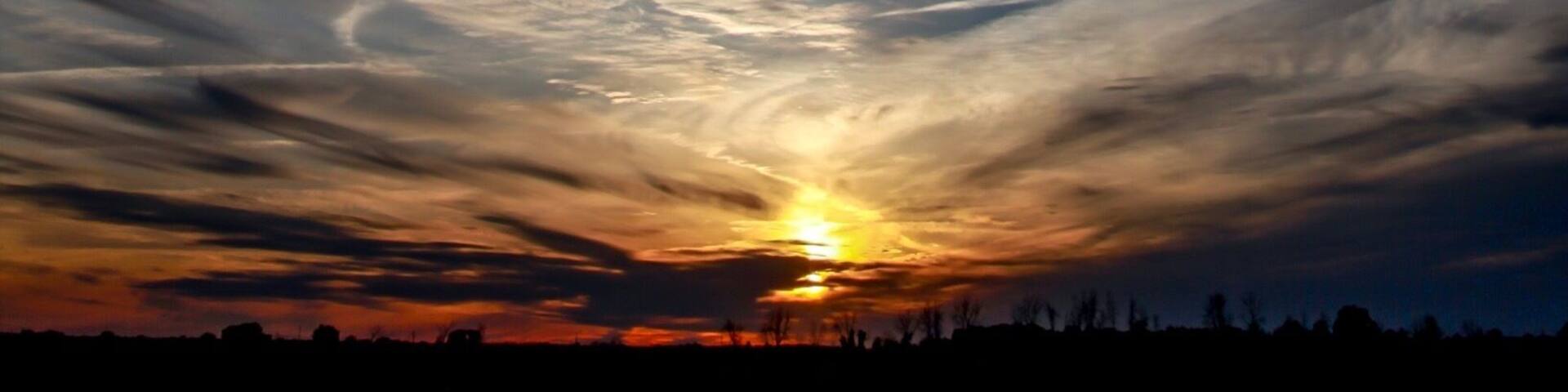 Sunset over a cornfield near Richmond Ontario Canada in later June. Canon. 5D Mark2 Tokina SDii 28-70mm