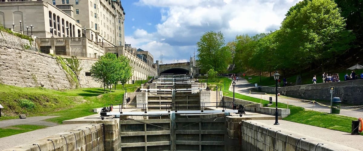 UNESCO World Heritage Site: Rideau Canal - Ottawa Lock, Ottawa, Canada 
The Rideau Canal connects Ottawa on the Ottawa River to Kingston on Lake Ontario. It is 202 kilometres in length. The canal was opened in 1832 as a precaution in case of war with the United States. It remains in use today primarily for pleasure boating, with most of its original structures intact. It is the oldest continuously operated canal system in North America. (Wikipedia) 
#UNESCOWorldHeritageSite #InStone #canal #Ottawa #Canada #Ontario #BVSblue  #TroveOnTuesday #NorthAmerica #RideauCanal #lock #perspective #History Photo Contest