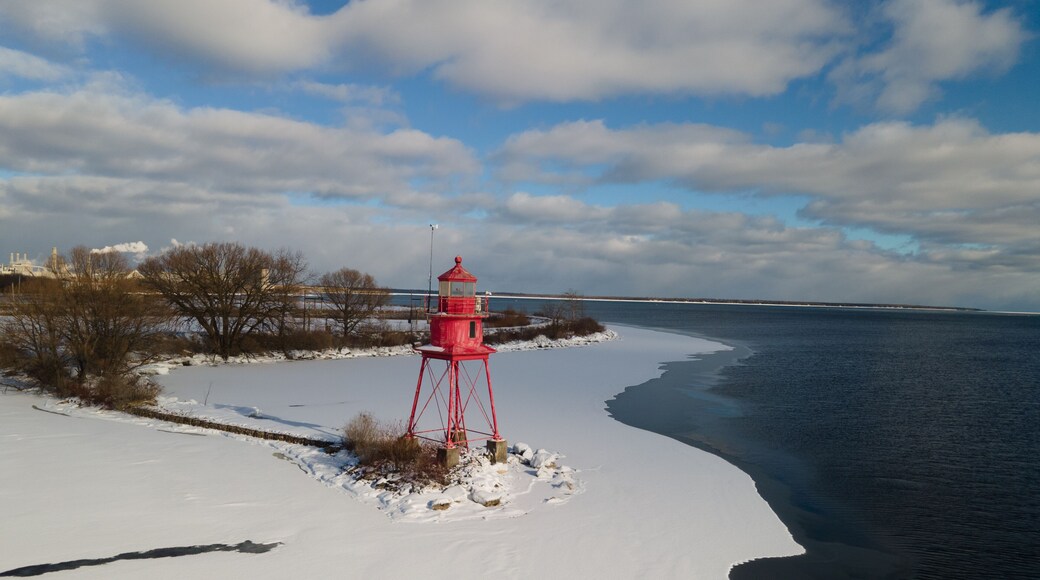Alpena, Michigan historic lighthouse along Lake Huron in the winter.