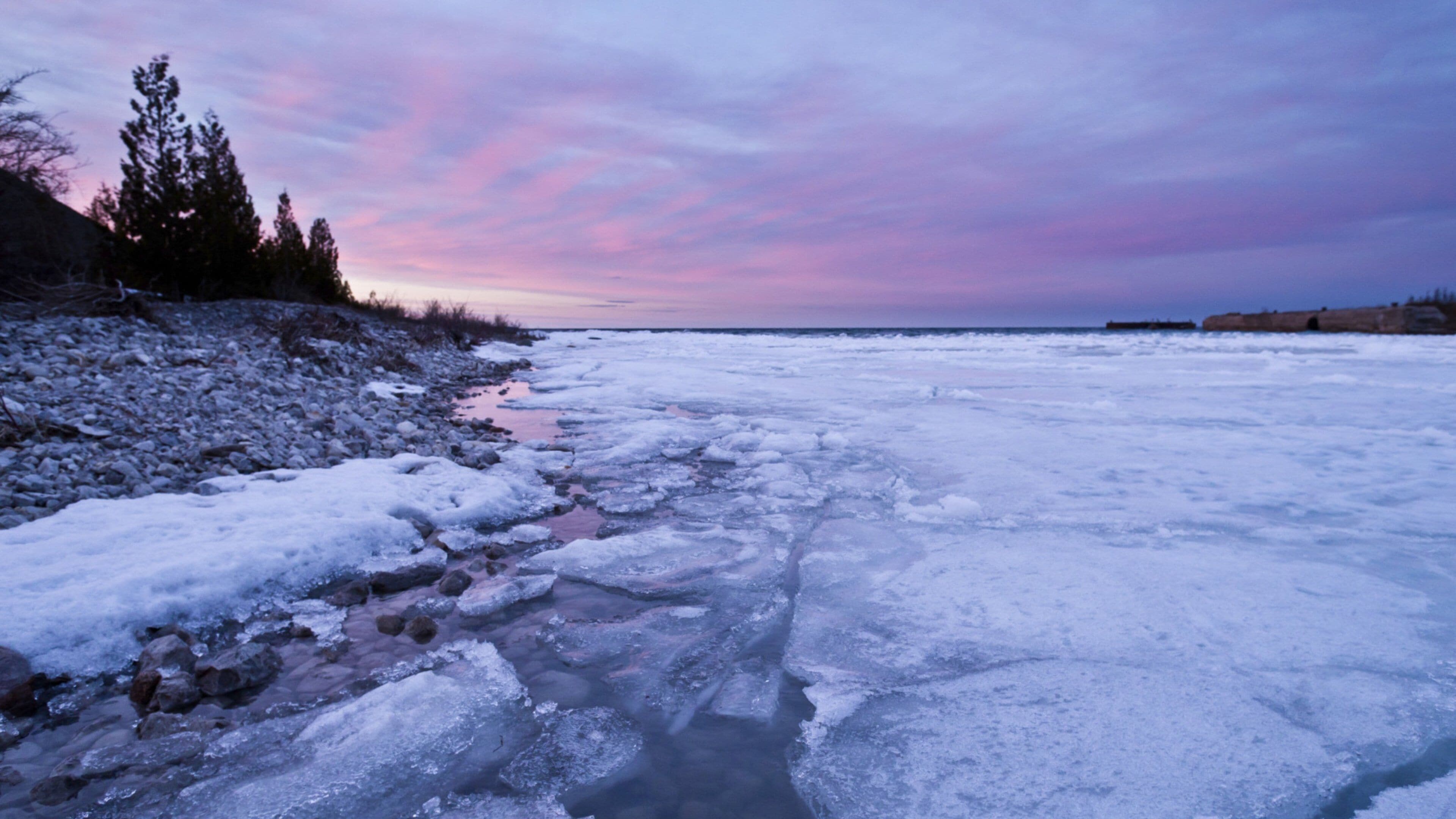 Alpena showing snow, a lake or waterhole and a sunset