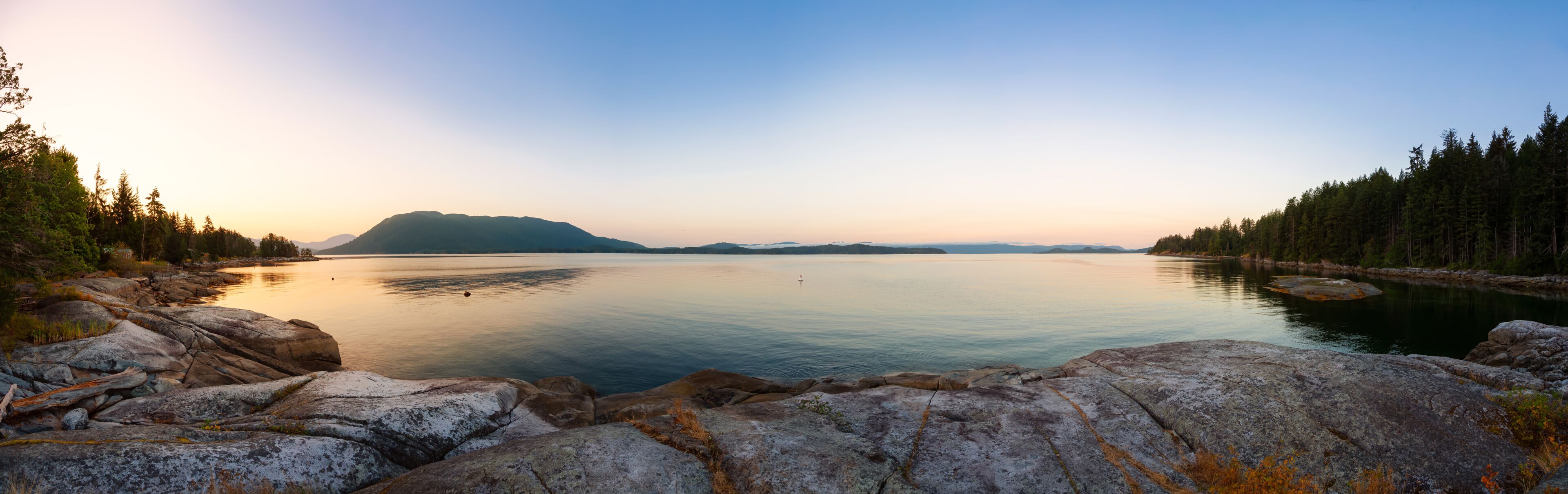 Panoramic View of Mermaid Cove during a colorful summer sunrise. Taken in Saltery Bay, Sunshine Coast, British Columbia, Canada.