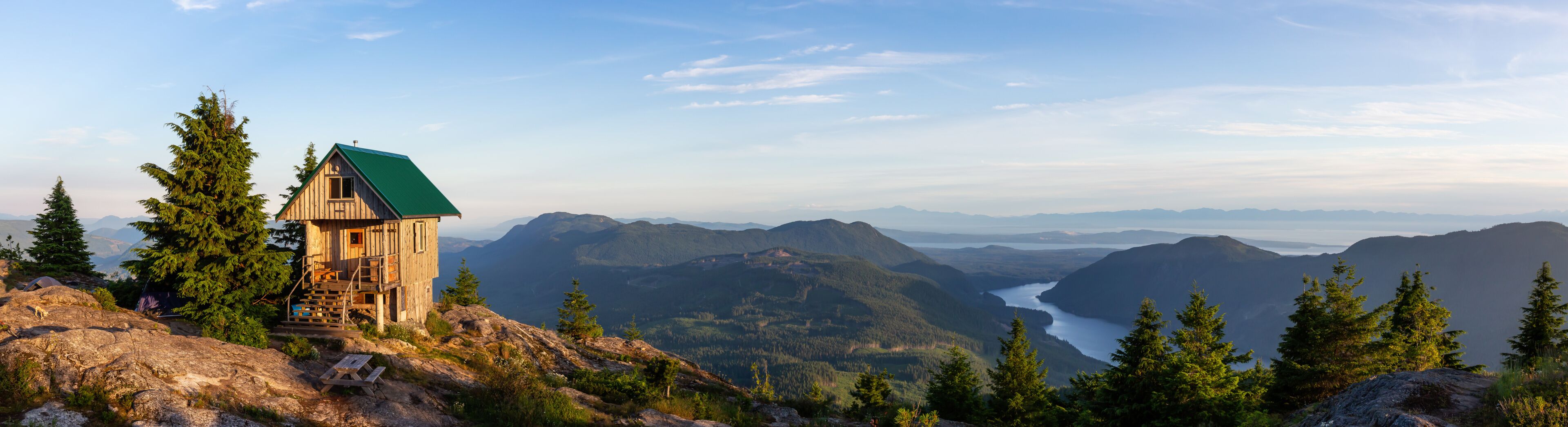 View of Tin Hat Cabin on top of a mountain during a sunny summer evening. Located near Powell River, Sunshine Coast, British Columbia, Canada.