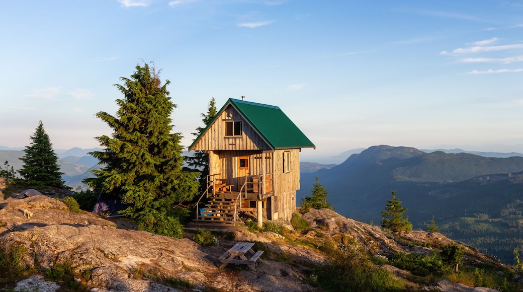 View of Tin Hat Cabin on top of a mountain during a sunny summer evening. Located near Powell River, Sunshine Coast, British Columbia, Canada.