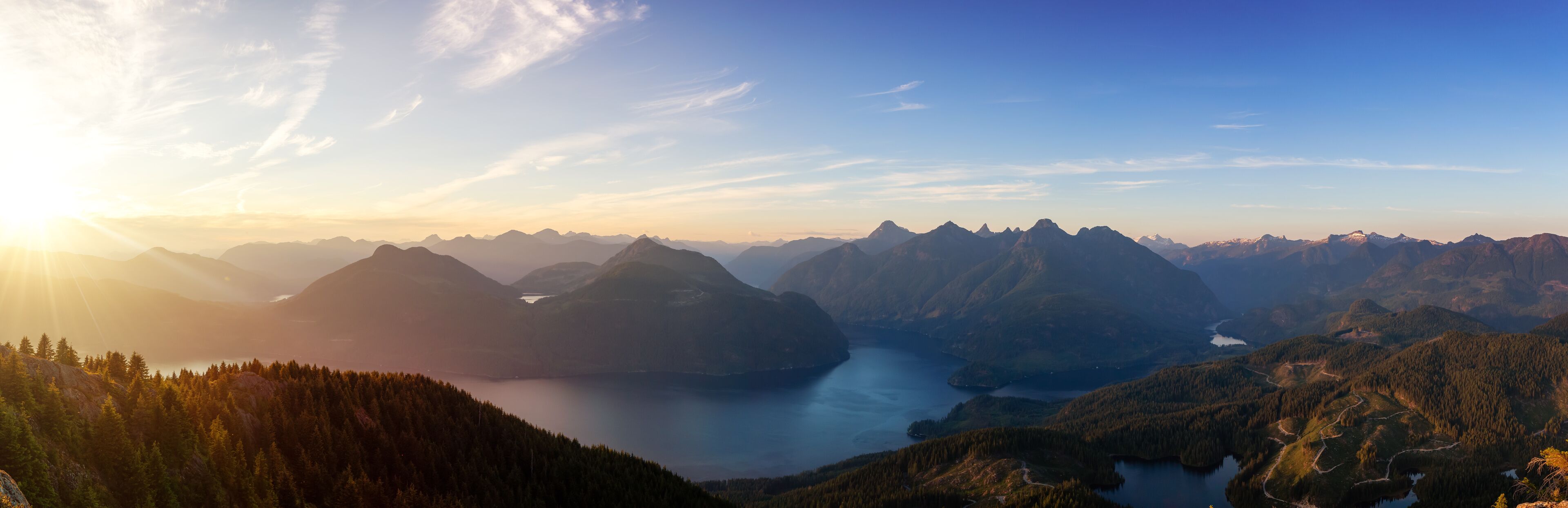 Beautiful Panoramic View of Canadian Nature Landscape from the top of Tin Hat Mountain during a sunny summer sunset. Taken near Powell River, Sunshine Coast, British Columbia, Canada.