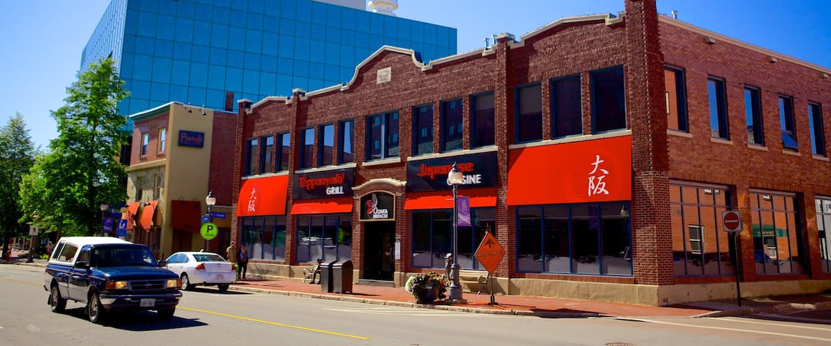 A street with a red-brick building housing a Japanese restaurant and a Tappanyaki Grill.