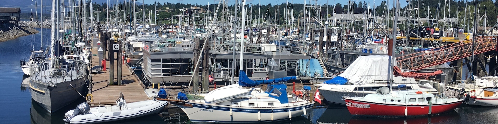 The pleasure craft harbour at Comox.  Comox is a lovely town of about 15,000 people on the southern coast of the Comox Peninsula in the Georgia Strait on the eastern coast of Vancouver Island, British Columbia.  The town has become a popular tourist attraction due to its good fishing, local wildlife, year-round golf and proximity to the Mount Washington ski area, the Forbidden Plateau, and Strathcona Provincial Park.