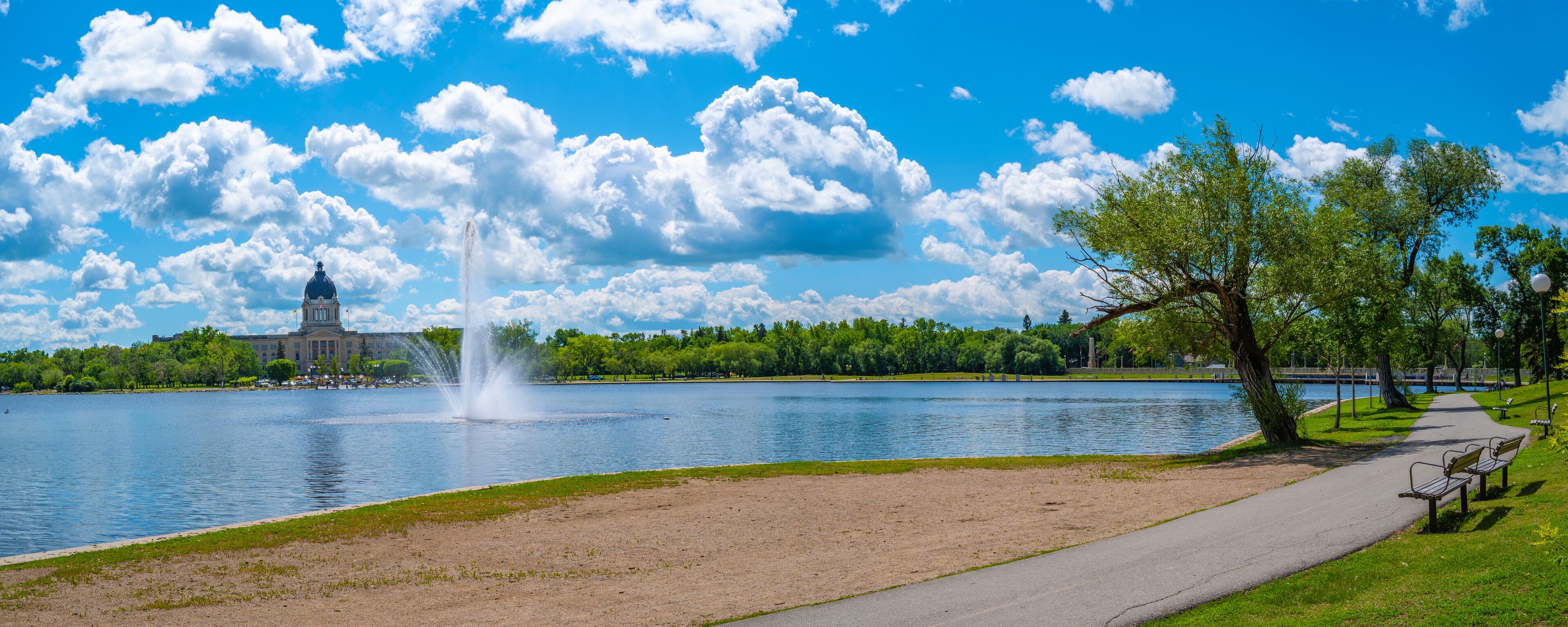 Wascana Park panoramic landscape with lake, fountain and walking path in Regina Saskatchewan Canada
