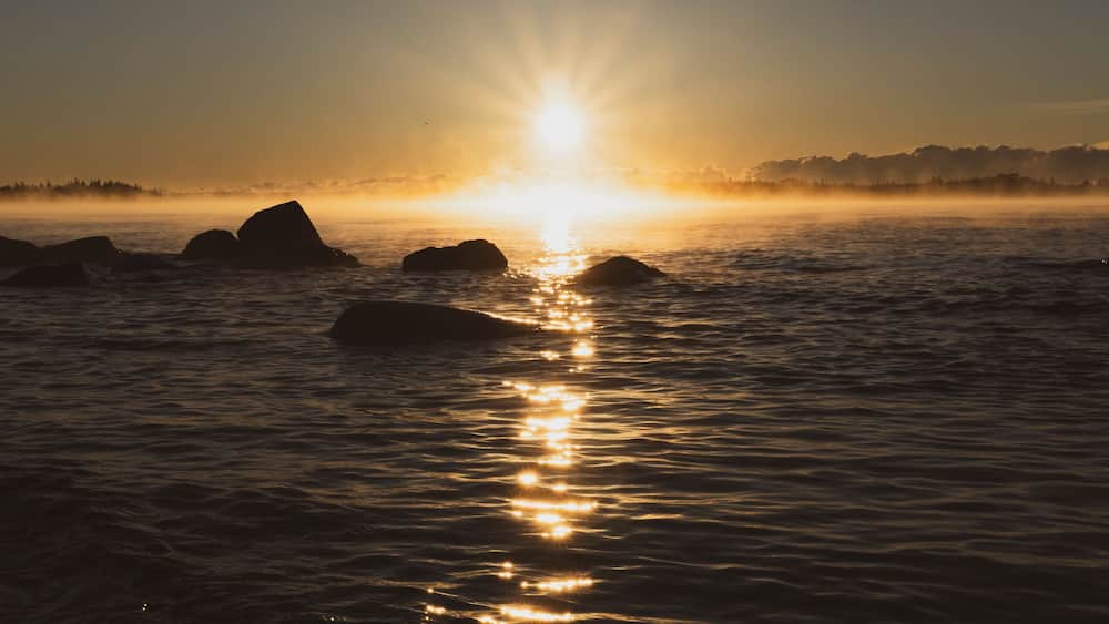 Sunrise over Lake Superior with rocky shoreline, Thunder Bay, Ontario