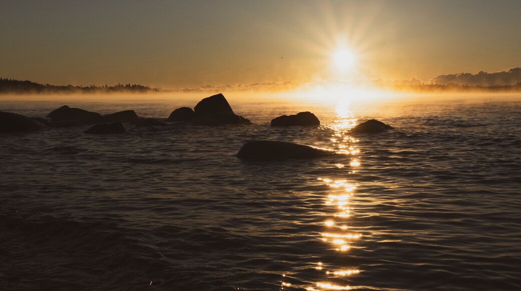 Sunrise over Lake Superior with rocky shoreline, Thunder Bay, Ontario