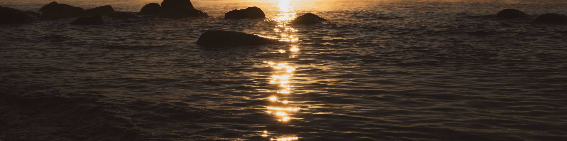 Sunrise over Lake Superior with rocky shoreline, Thunder Bay, Ontario