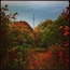A tower surrounded by autumn foliage.