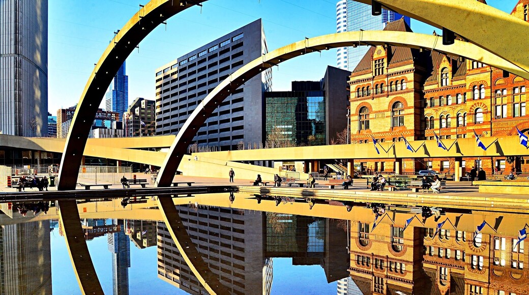 #Golden Sunset at the reflective pool of Nathan Phillips Square, in front of Toronto City Hall.
#Toronto #Canada #reflection #sunset #pool #arch