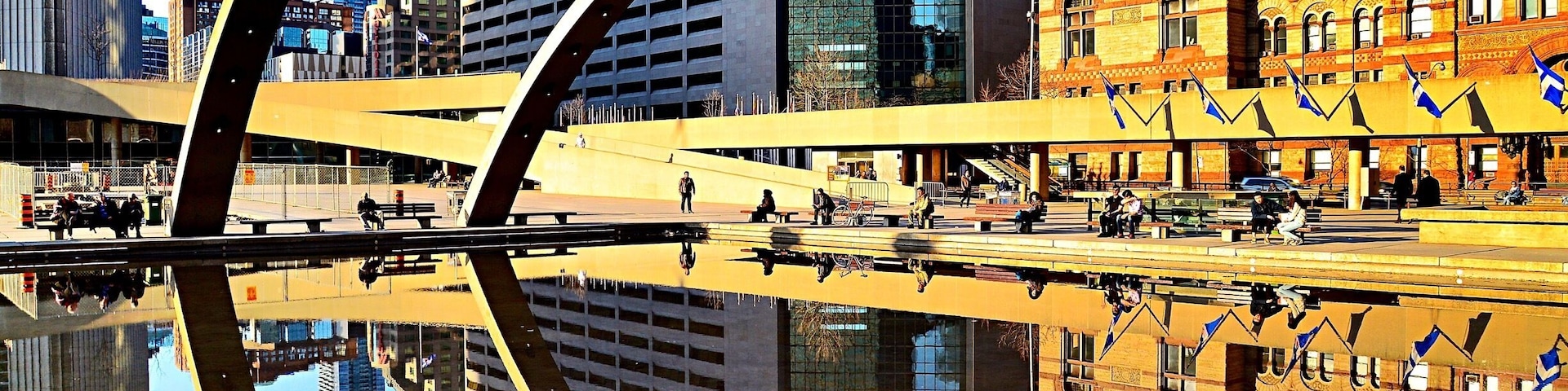 #Golden Sunset at the reflective pool of Nathan Phillips Square, in front of Toronto City Hall.
#Toronto #Canada #reflection #sunset #pool #arch